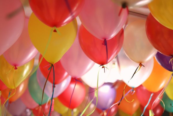 pink and yellow balloons in close up photography